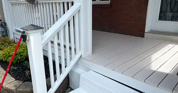 White painted porch floor, railing and stair balusters