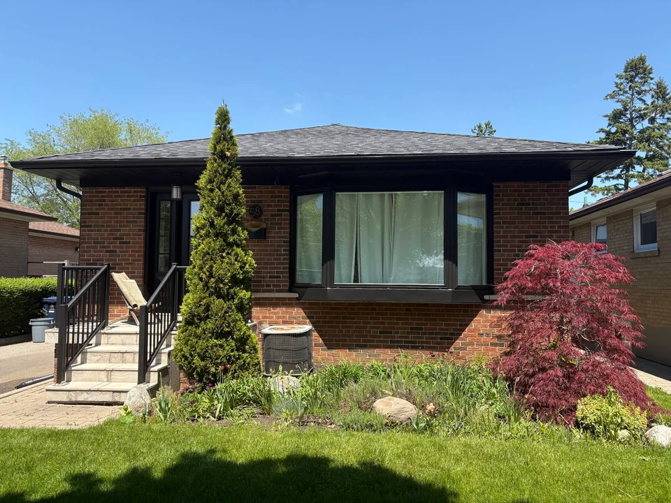 After: black front soffit and fascia above the bungalow window